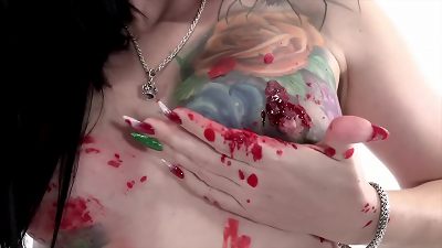 tattooed babe Marie Bossette covers herself in warm wax